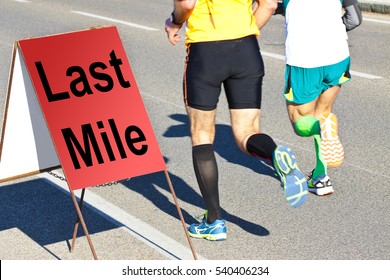 Two Runners Are Running The Last Mile - Concept Image