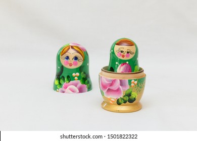 Two Russian Dolls On A White Background