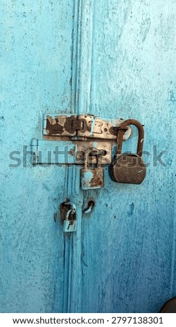 Two rusty padlocks securing a wooden door, symbolizing security, protection, privacy, restriction, and the passage of time. Weathered metal and aged wood create a strong vintage and historical atmosphere. Suitable for security, abandonment, heritage architecture, mystery, and access control concepts.