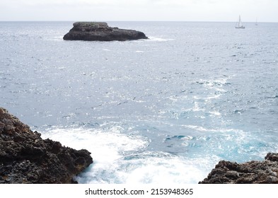 Two Sailboats In The Far Distance