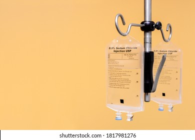 Two Saline IV Bags Hanging from IV Pole
