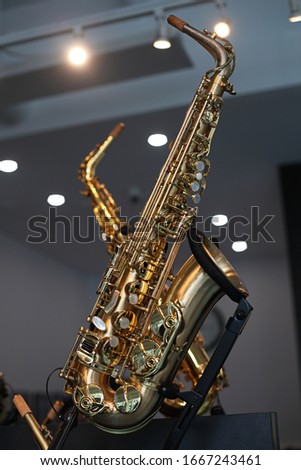 Two saxophones in a shop