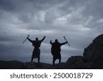 Two Scandinavian Viking warriors in full armor against dramatic landscape