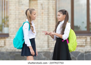 Two School Girls Friends Talking Together Duting School Break