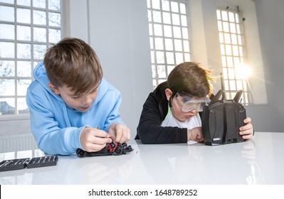 Two School Kids Trying Out New Things Regarding Technology