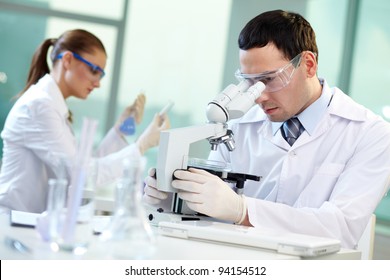 Two scientists conducting research in a lab environment - Powered by Shutterstock