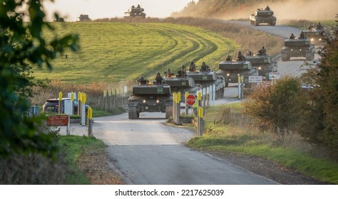 Two Sections Of British Army FV4034 Challenger 2 Ii Main Battle Tanks At A Main Road Junction Crossing, Wiltshire UK