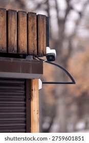 A close‑up of two security cameras mounted on a building corner