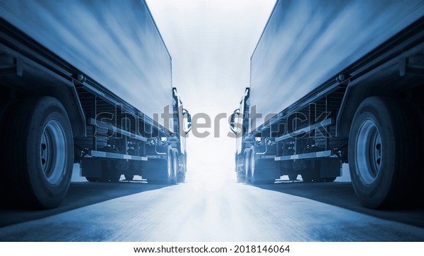 Two Semi
Trailer Trucks Parking with Sunlight. Industry Road Freight by
Truck. Logistic and Cargo Transport
Concept.	