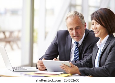 Two Senior Business Colleagues At Meeting, Close-up