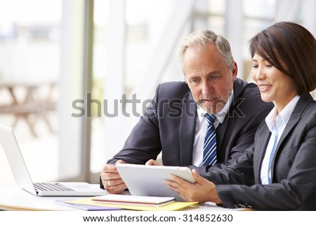 Two senior business colleagues at meeting, close-up