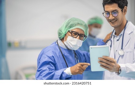 Two senior doctor hold clipboard document file of patient record talking discussion about treatment guidelines. Men surgeon doctor advice assistance expertise for comprehensive holistic treatment team - Powered by Shutterstock