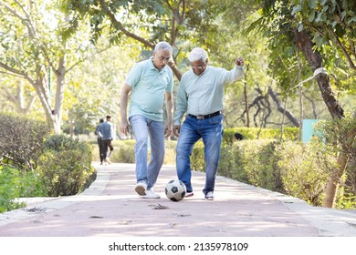 Two senior man having fun while playing football at park
 - Powered by Shutterstock