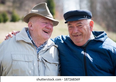 Two Senior Men Laughing And Talking