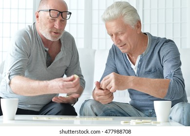 Two Senior Men  Playing Domino