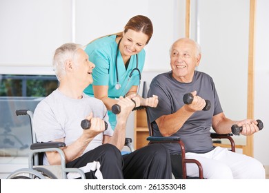 Two senior men in wheelchairs lifting dumbbells during physiotherapy - Powered by Shutterstock