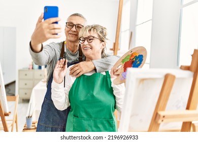 Two Senior Paint Student Smiling Happy Making Selfie By The Smartphone At Art Studio.