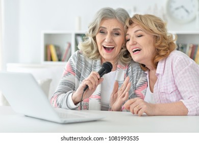 Two  Senior Women Singing Karaoke