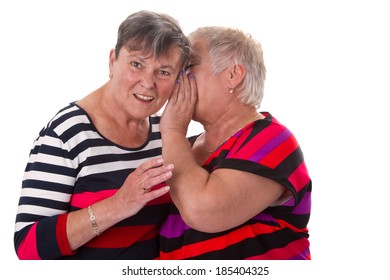 Two Senior Women Whispering - Isolated