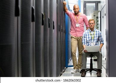 Two Serious technicians working in the data center