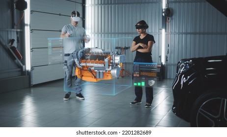 Two service manager engineers use virtual reality technology to diagnose an eco-friendly car engine with an augmented reality interface and 3D engine visualization - Powered by Shutterstock