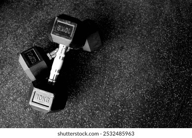 Two set of dumbell barbell left position in gym equipment on black isolated texture backround for text