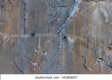 Two Sets Of Climbers Climbing The Giant Granite Rock Wall Of El Capitan In Yosemite NP