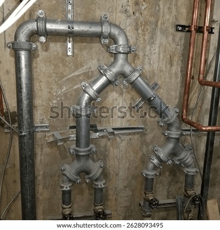 two sets of duplex pump discharge piping, in galvenized groove piping. 
