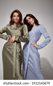 Two sexy brunette woman luxury lifestyle bright makeup wear natural organic silk midi dress and high heels perfect body fashion model style for meeting party romantic date studio grey background.