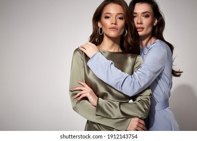 Two Sexy Brunette Woman Luxury Lifestyle Bright Makeup Wear Natural Organic Silk Midi Dress And High Heels Perfect Body Fashion Model Style For Meeting Party Romantic Date Studio Grey Background.