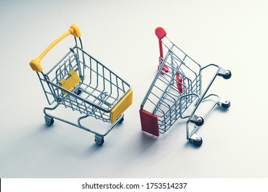 Two Shopping Carts - Business Metaphor - Trade War, Rivalry Of Markets, Competition Concept. Cart, Buggy, Carriage