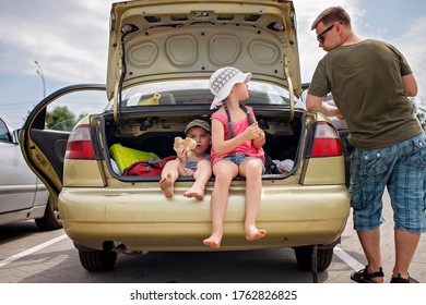 Two Sibling Having Break During Family Road Trip And Eating Bread In Car On The Parking, Family Local Weekend, New Normal And Staycation