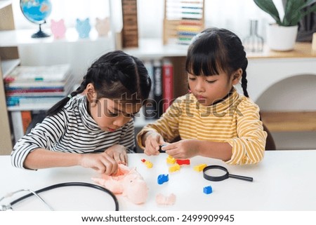 two sibling Playing Anatomy studies for kids. Human body organs and skeleton parts toy. Learning medical terms, order and location of each part. at home.