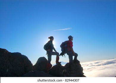 Two Silhouette Hikers Climbing Mountain Mt St. Helens