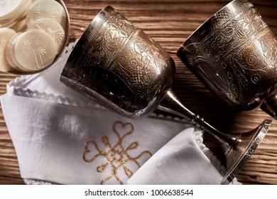 Two silver chalices to hold the wine symbolising the blood of Christ and Hosties symbolising his body for the Holy Communion