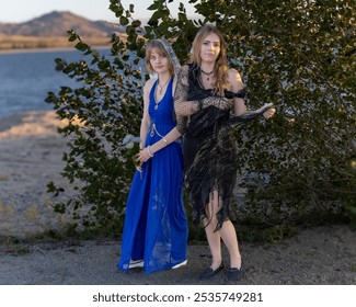 Two sisters cosplaying as Samhain goddesses on a beach, adorned with floral crowns and flowing attire. Set against a coastal backdrop, perfect for themes of fantasy, mythology, and mystical beauty. - Powered by Shutterstock