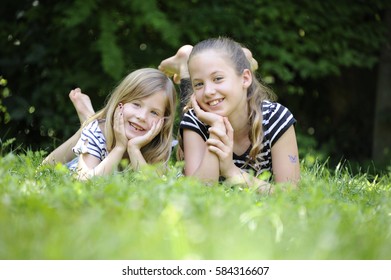 Two Sisters Laying Down Leaning On Stock Photo 584316598 | Shutterstock