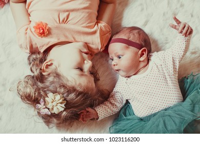 Two sisters play