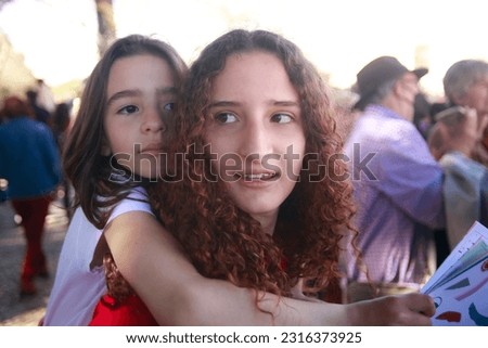 Similar – Happy women looking at camera over garden fence