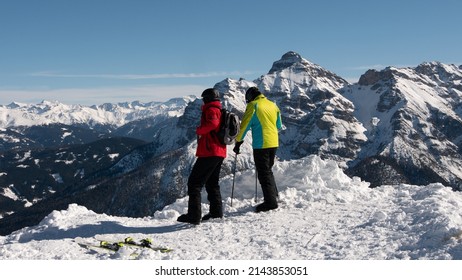 Two Skiers Enjoy The Alpine Landscape