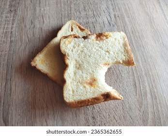Two slices of bread that have been bitten - Shutterstock ID 2365362655