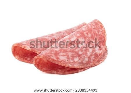 Two slices of delicious smoked sausage isolated on white background. Sliced sausage servelat. Copy space.