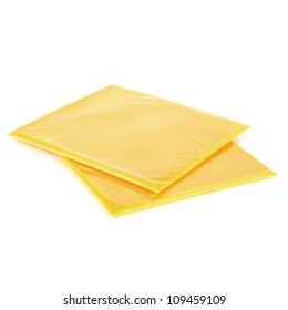 Two Slices Of Processed American Cheese On White Background