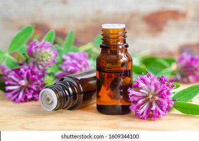 Two Small Bottles With Red Clover Extract (tincture, Infusion, Oil). Aromatherapy, Spa And Herbal Medicine Ingredients. Copy Space  