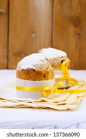 Two small cakes under dusting of icing sugar