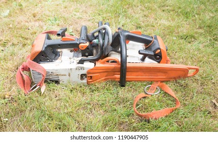 Two small chainsaws clipped together ready to start work