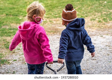 Two Small Children Pulling Wagon