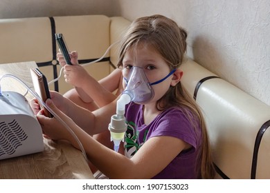 Two Small Children Take Turns Taking Inhalation For A Sore Throat At Home