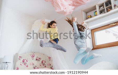 Similar – Foto Bild Zwei Mädchen hüpfen auf dem Trampolin, in der Natur.