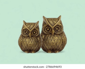 Two small owl statues representing wisdom for home office decor